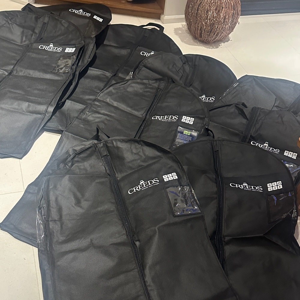 BNWOT Set of 9 Creeds Garment bags.